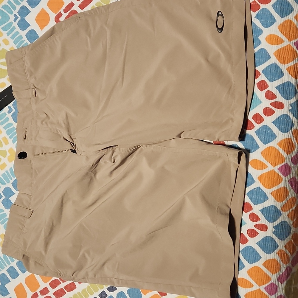 2 PAIRS Oakley KHAKI/LT GREY golf shorts. 9 inseam. 34.
